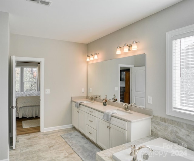 bathroom featuring a bathing tub and vanity