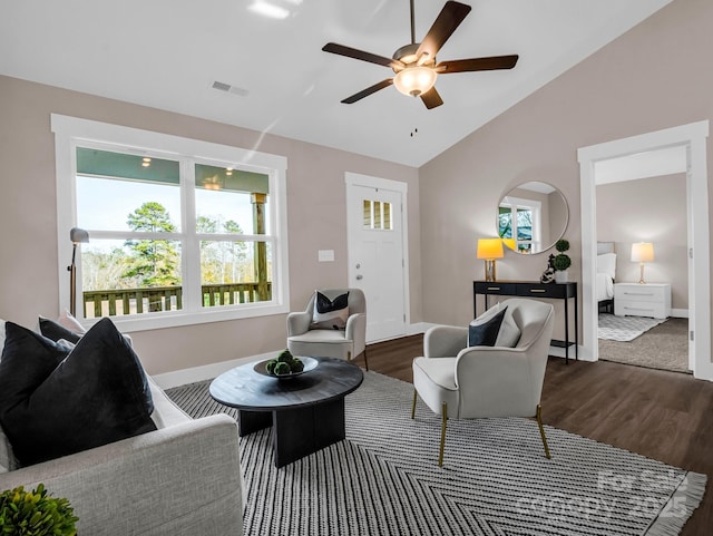 living room featuring lofted ceiling, ceiling fan, hardwood / wood-style flooring, and plenty of natural light