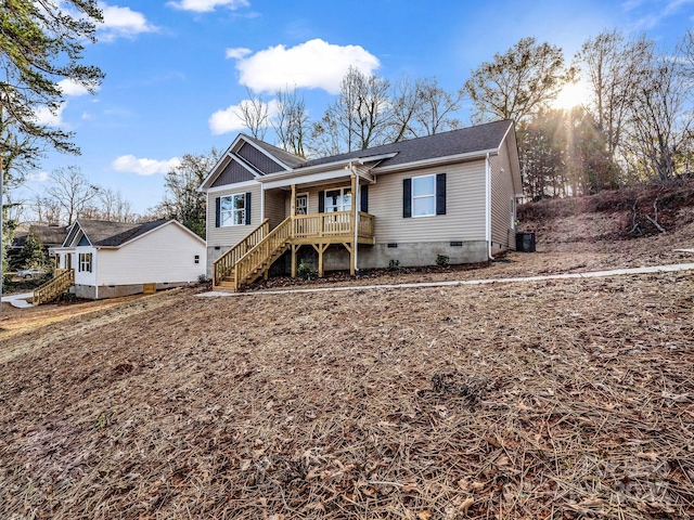 view of front of home featuring cooling unit and covered porch