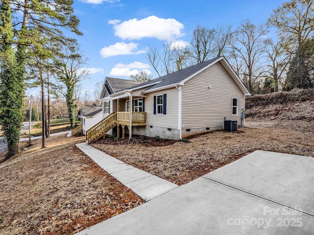 view of property exterior featuring cooling unit and covered porch