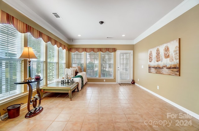 living area featuring light tile patterned flooring and ornamental molding