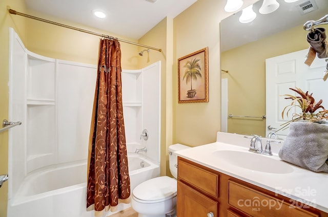 full bathroom featuring vanity, toilet, and shower / bath combo with shower curtain