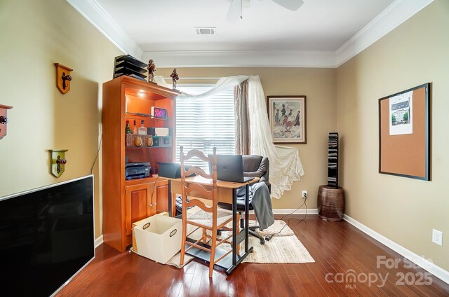 office with crown molding, visible vents, dark wood-style flooring, and baseboards