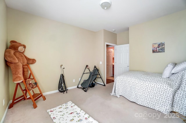 carpeted bedroom with baseboards