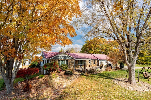 ranch-style home with a front yard