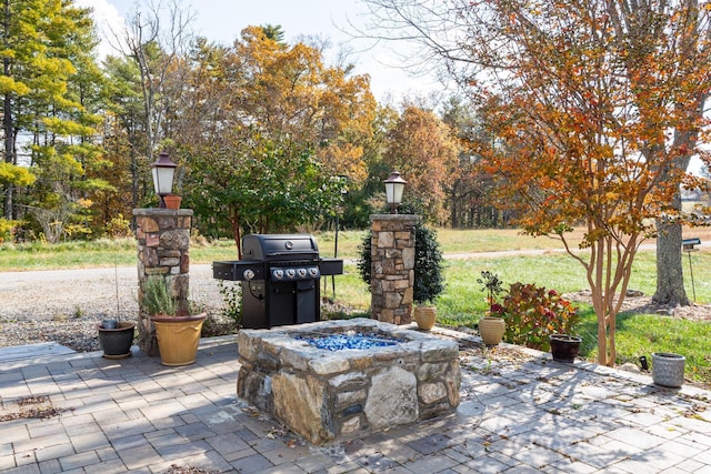 view of patio featuring grilling area and an outdoor fire pit