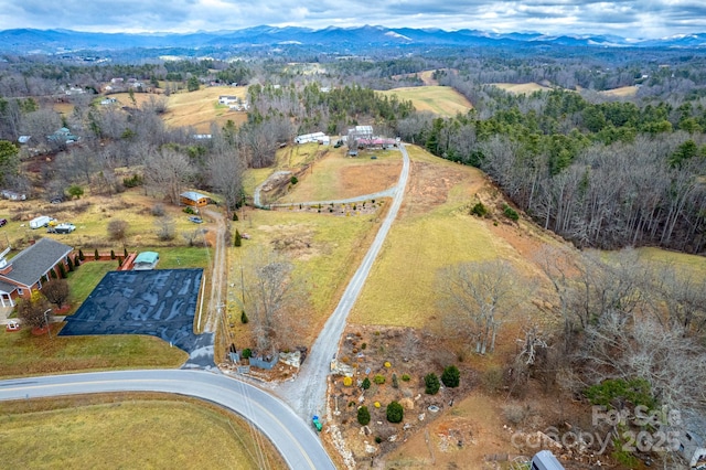 bird's eye view with a mountain view and a rural view