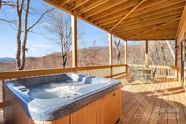 deck featuring a hot tub