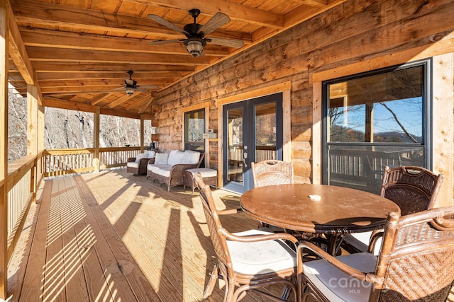 deck featuring ceiling fan and french doors