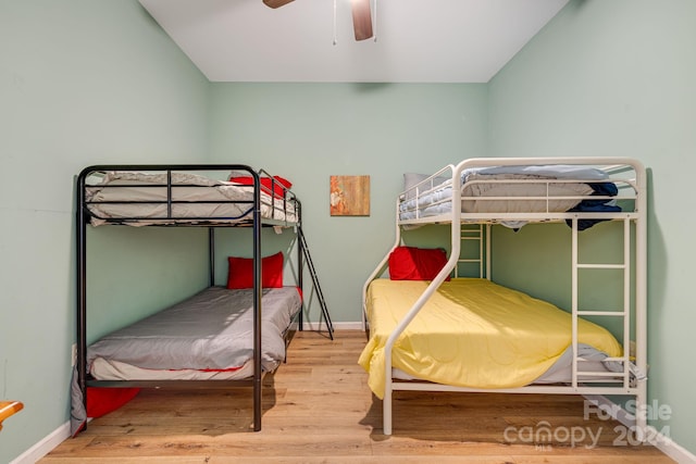 bedroom featuring ceiling fan and hardwood / wood-style flooring