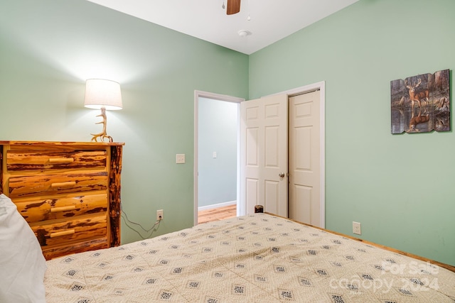 bedroom with ceiling fan and a closet