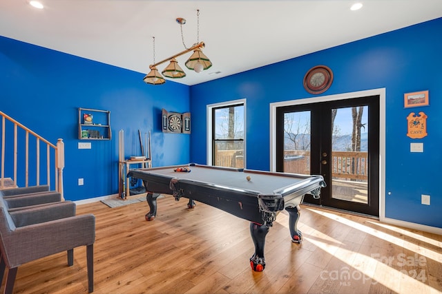 recreation room featuring french doors, light wood-type flooring, and billiards