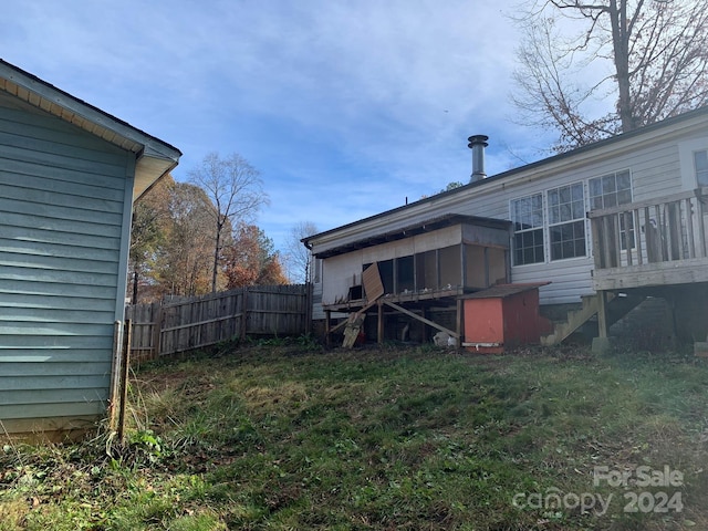 back of property featuring a sunroom