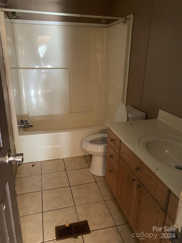 full bathroom with tile patterned floors, vanity, shower / bathtub combination, and toilet