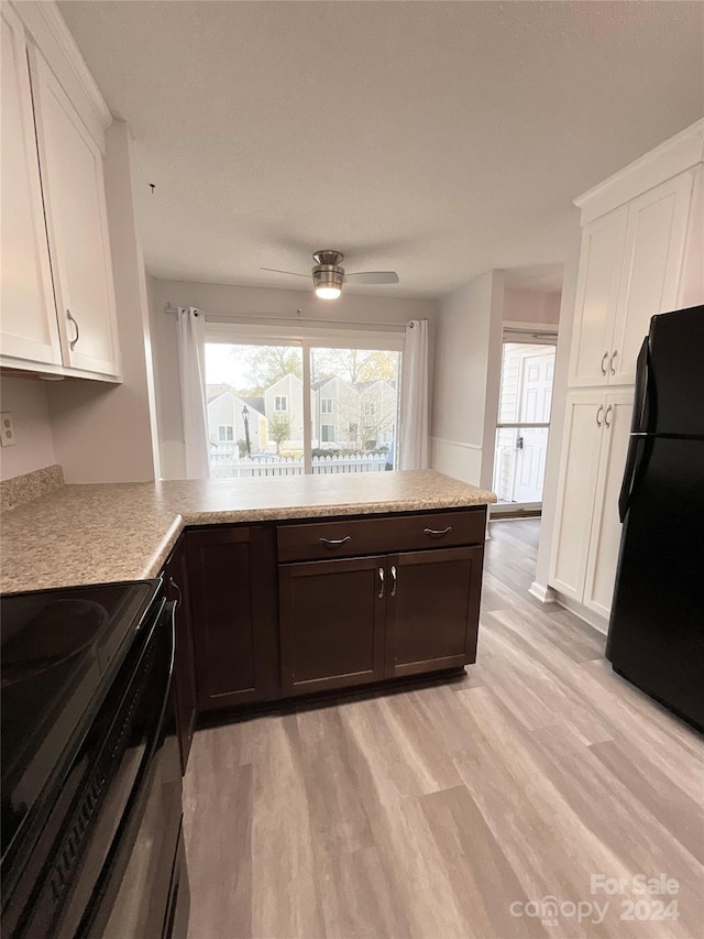 kitchen featuring white cabinetry, ceiling fan, light hardwood / wood-style floors, dark brown cabinets, and black appliances