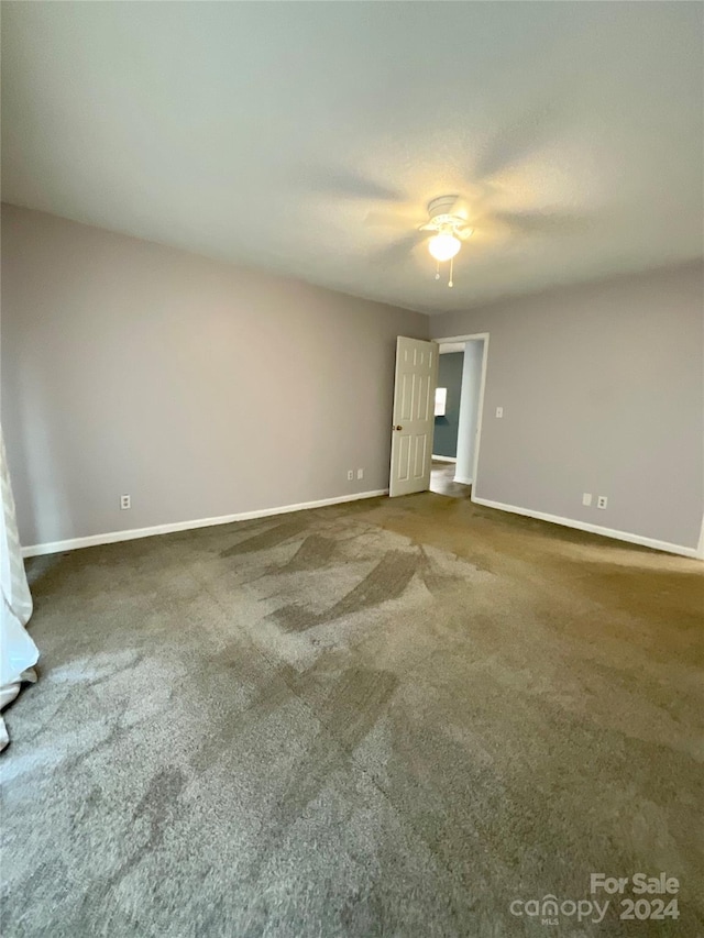 spare room featuring carpet