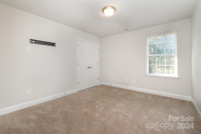 unfurnished room with carpet floors