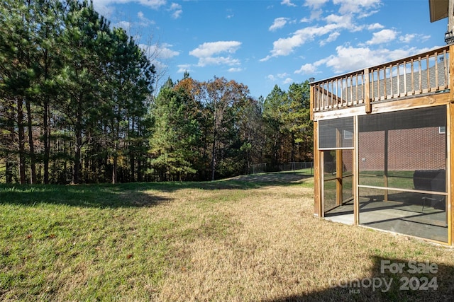 view of yard with a wooden deck