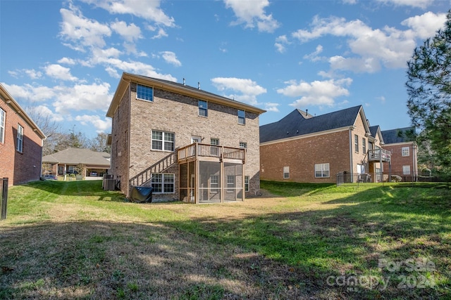 back of house with a lawn, a deck, and central air condition unit