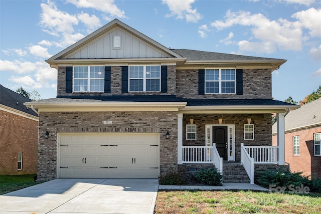 craftsman-style house featuring covered porch and a garage