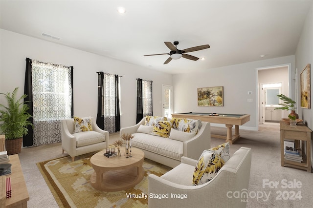 carpeted living room featuring ceiling fan and billiards