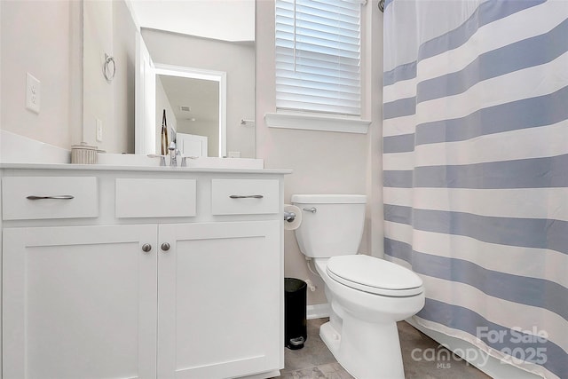 bathroom with vanity, toilet, and a shower with shower curtain