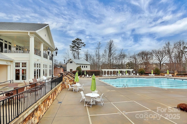 view of swimming pool with a patio area