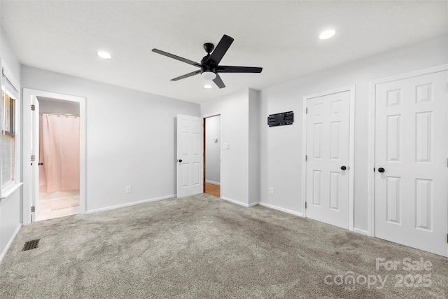 unfurnished bedroom with visible vents, baseboards, carpet flooring, and recessed lighting