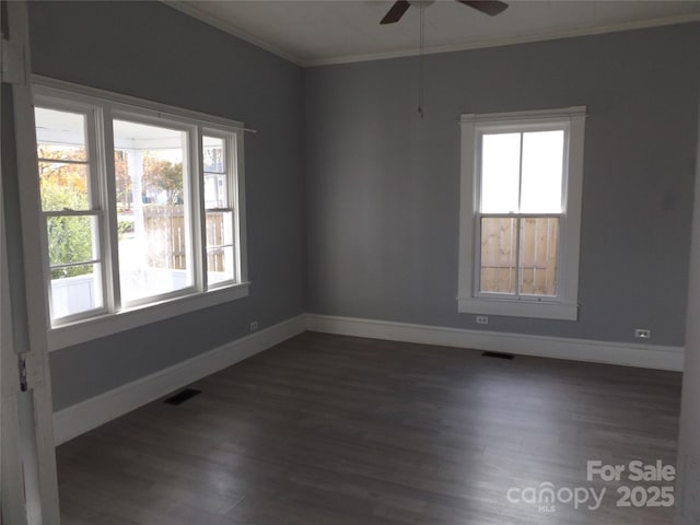 unfurnished room featuring ceiling fan, dark hardwood / wood-style floors, and crown molding