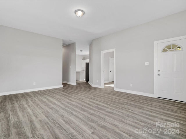 unfurnished living room with light hardwood / wood-style flooring