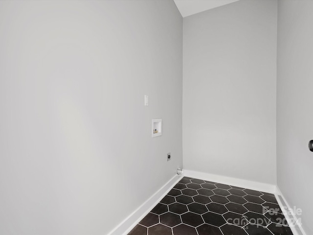 washroom with tile patterned flooring and washer hookup