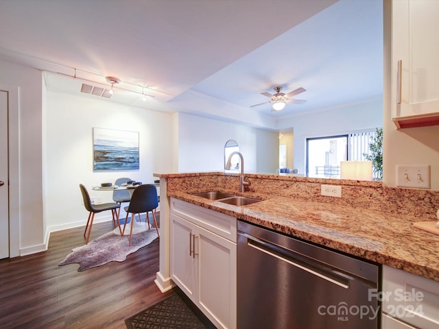 kitchen featuring light stone countertops, dark wood-type flooring, sink, dishwasher, and white cabinetry