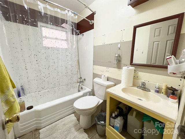 full bathroom featuring tile patterned flooring, shower / bath combo, vanity, and toilet