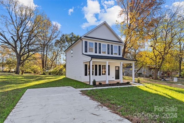 view of front of home featuring a porch and a front yard