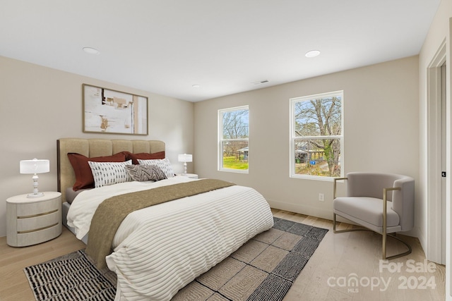 bedroom with hardwood / wood-style flooring