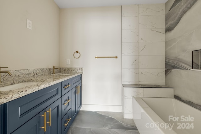 bathroom with vanity and a washtub