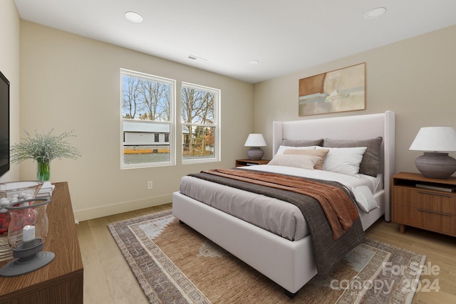 bedroom with wood-type flooring