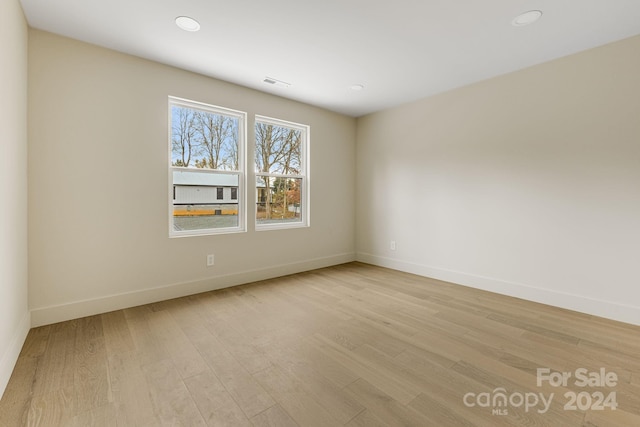 unfurnished room featuring light hardwood / wood-style floors