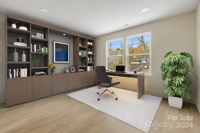 office space with light wood-type flooring