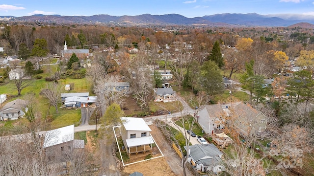 birds eye view of property featuring a mountain view