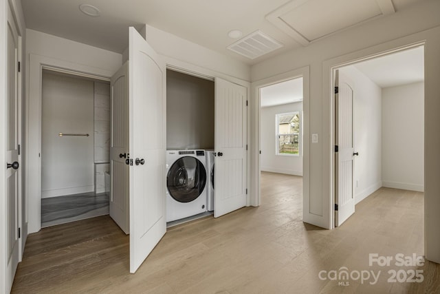 65 Bellevue Rd Unit 3, Asheville, NC 28803 - clothes washing area featuring washer / dryer, attic access, light wood-type flooring, and baseboards