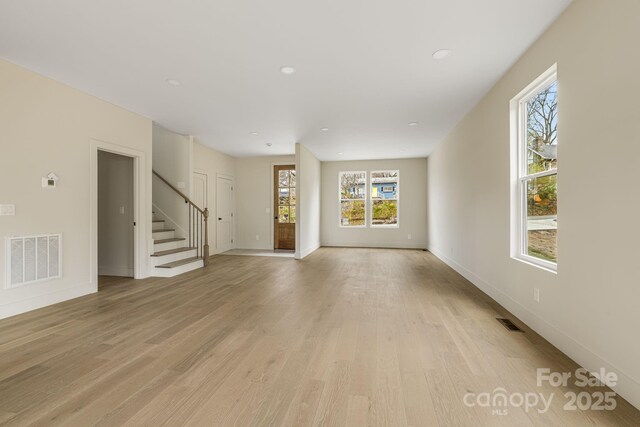 65 Bellevue Rd Unit 3, Asheville, NC 28803 - unfurnished living room featuring stairs, light wood finished floors, baseboards, and recessed lighting