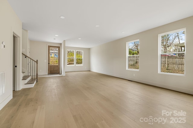 65 Bellevue Rd Unit 3, Asheville, NC 28803 - unfurnished living room with stairway, light wood-type flooring, healthy amount of natural light, baseboards, and recessed lighting