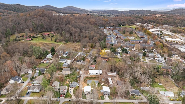 65 Bellevue Rd Unit 3, Asheville, NC 28803 - aerial view of property and surrounding area with a heavily wooded area, a mountain backdrop, and nearby suburban area