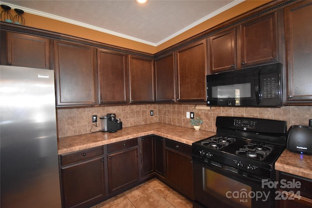 kitchen with decorative backsplash, dark brown cabinets, light tile patterned floors, black appliances, and ornamental molding