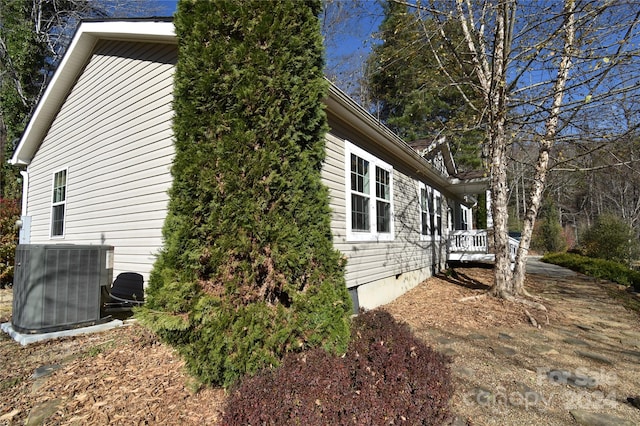 view of side of home with cooling unit