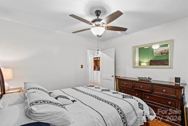 bedroom with ceiling fan, crown molding, and light hardwood / wood-style floors