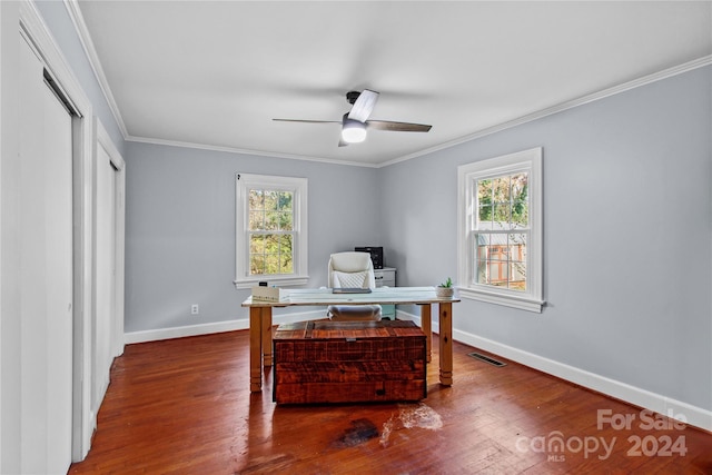 office area with dark wood-type flooring, crown molding, and a healthy amount of sunlight