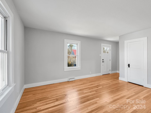 spare room with light wood-type flooring