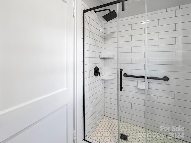 bathroom with an enclosed shower